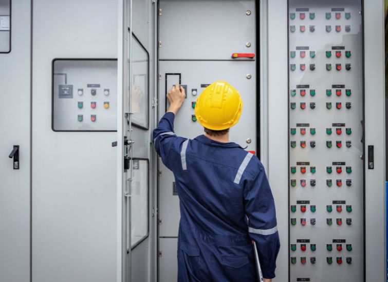 Focused electrician working within a bustling electric hub