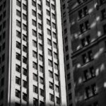 a-striking-black-and-white-image-of-towering-urban-skyscrapers-in-a-cityscape-1