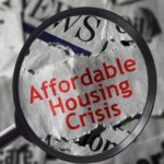 A magnifying glass highlighting the phrase "affordable housing crisis" on a background of newspaper clippings featuring words like "fear" and "uncertainty.