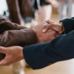 close-up-of-two-businesspeople-shaking-hands-symbolizing-agreement-and-partnership