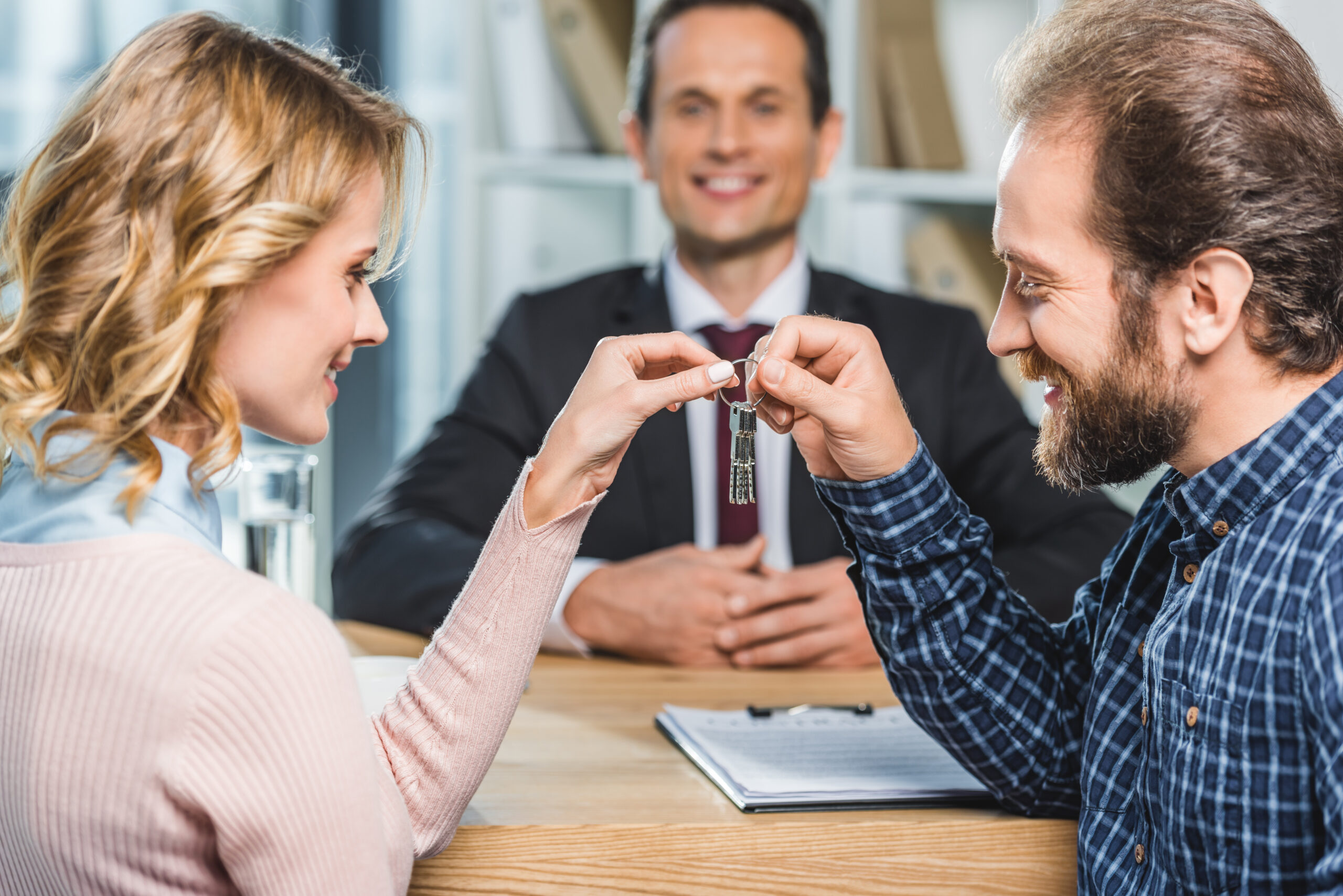 couple holding keys from home