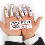 A person's hand with labeled fingers symbolizing the various aspects of property management.