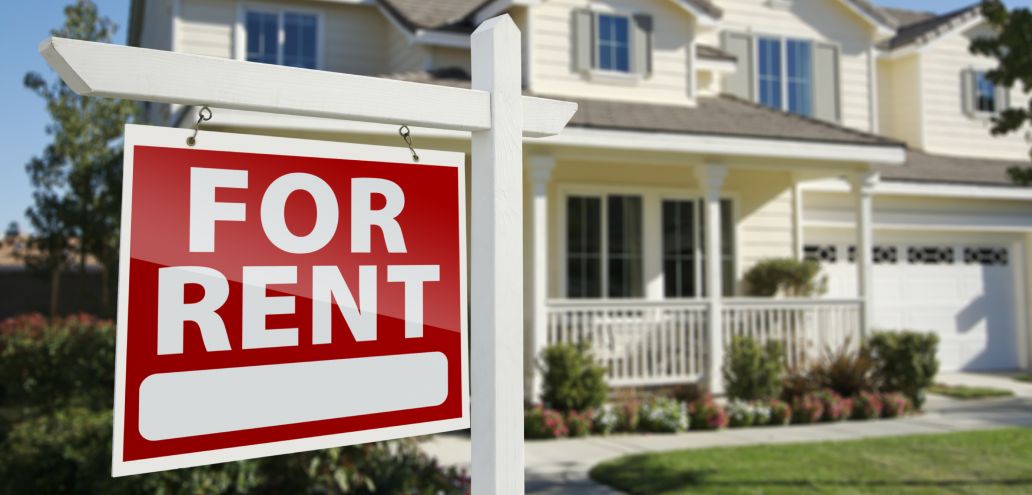 A for rent sign in front of a house in Detroit.