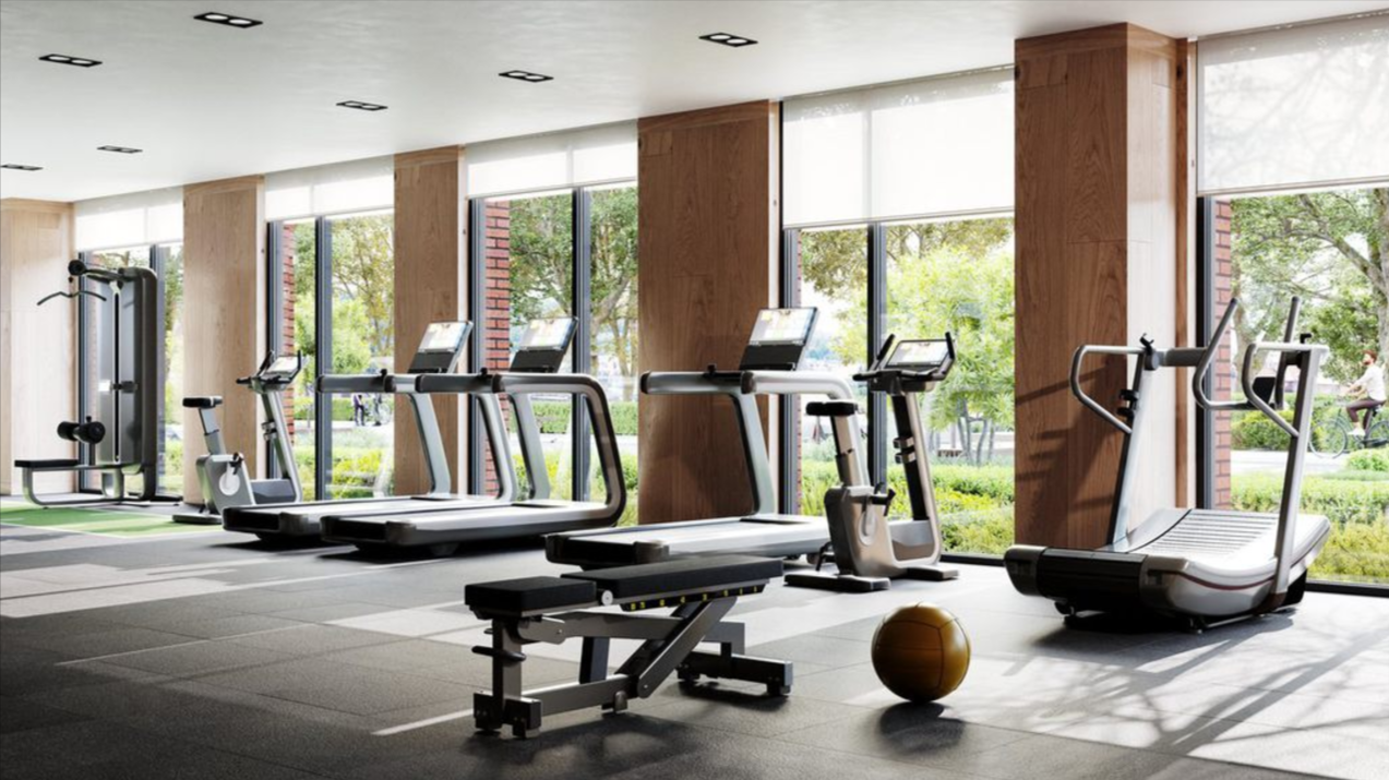 Indoor amenities include a full-time concierge and a gym with stretching areas